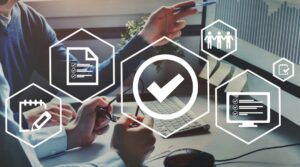 Business Valuation Methods, represented by image of 2 business people looking a computer screen.