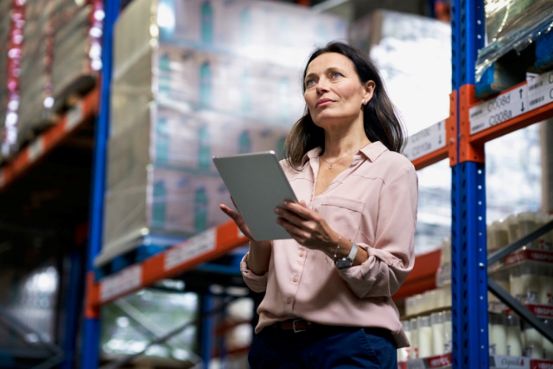 Women holding iPad, reflecting a business valuation