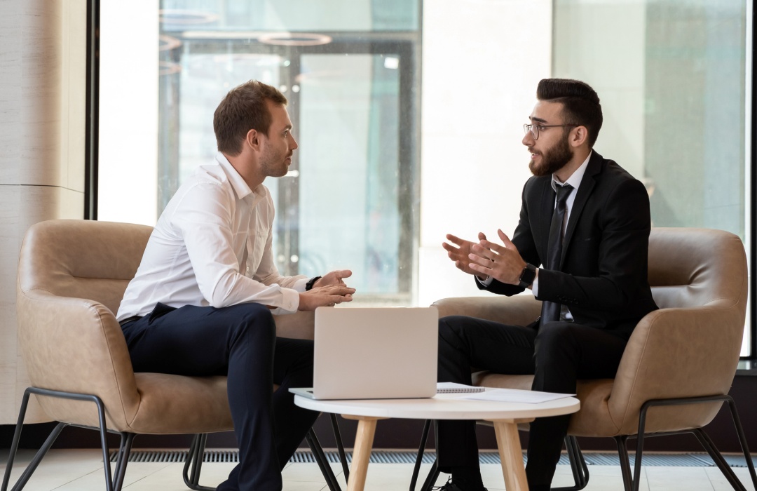 Two men talking about writing a letter of intent