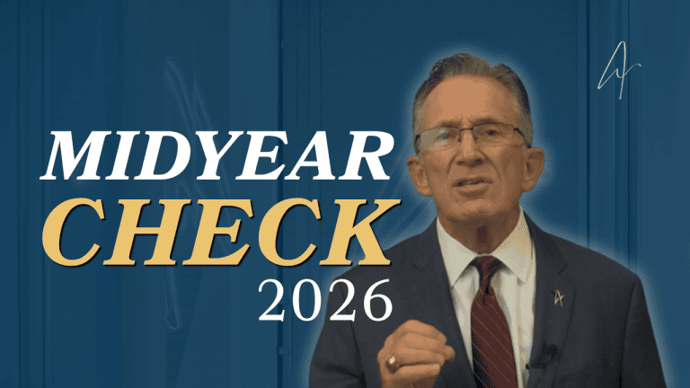 Man in navy suit and red tie speaking beside bold text reading Midyear Check 2026 on a blue background.