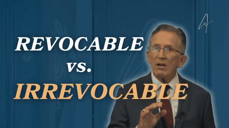 Estate planning attorney in a suit gesturing beside text reading Revocable vs. Irrevocable
